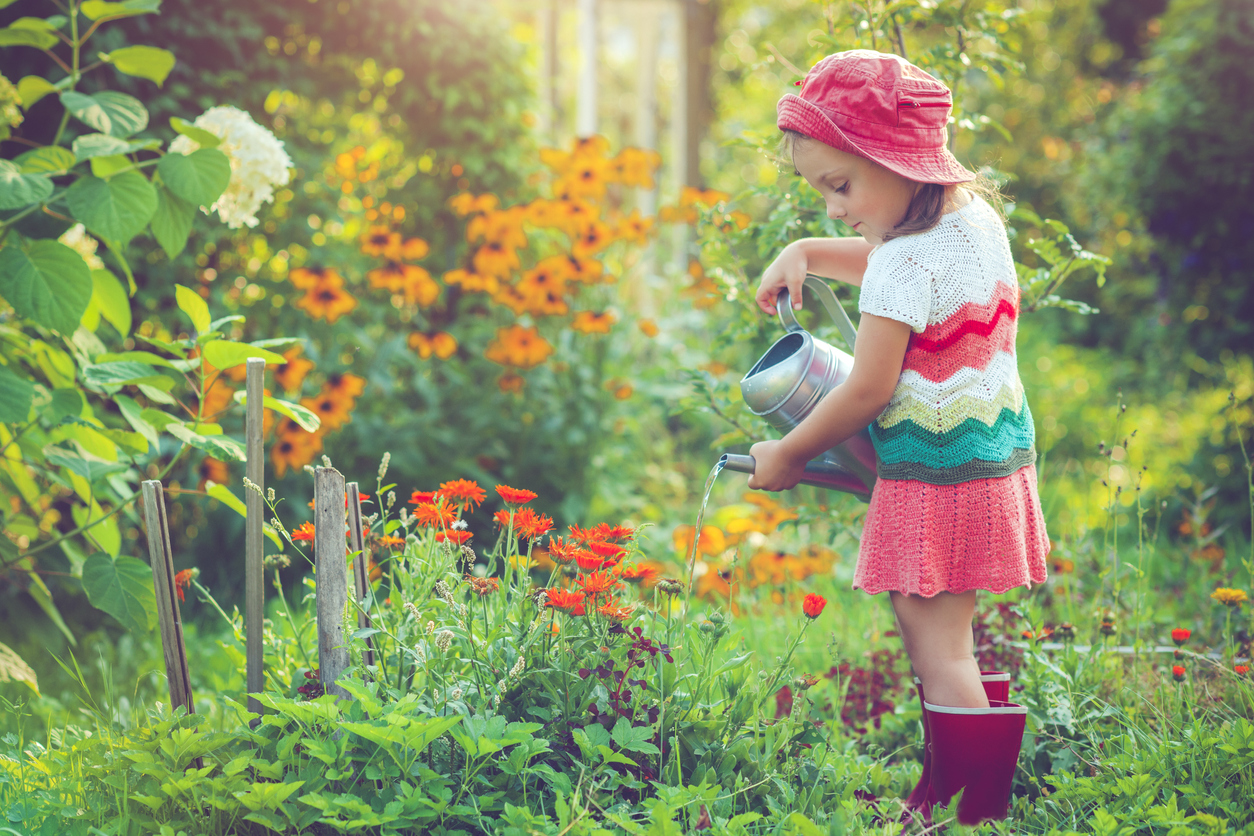 Happy little girl in garden